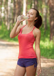 Photo: Fitness woman drinking water Fitness woman drinking water