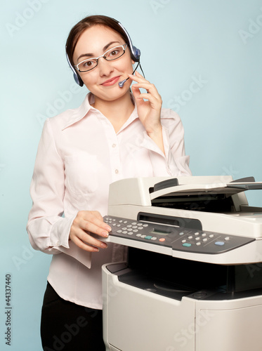 Photo: Businesswoman with copier Businesswoman with copier