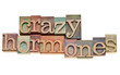 crazy hormones text  in wood type