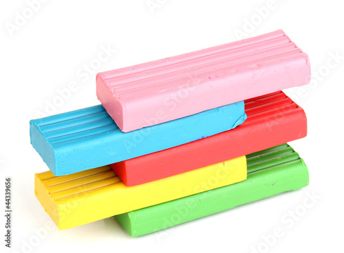 Photo: Children bright plasticine isolated on white Children bright plasticine isolated on white
