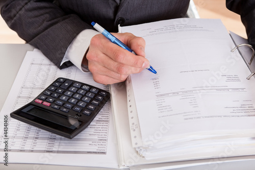 Photo: Accountant working at the office Accountant working at the office
