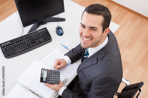 Photo: Accountant working at the office Accountant working at the office