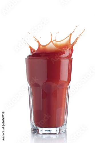 Photo: Tomato juice splash in a glass Tomato juice splash in a glass