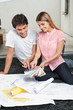 Couple Choosing Color From Swatches