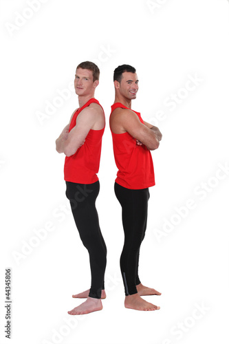 Photo: Gymnasts standing back to back Gymnasts standing back to back