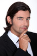 Businessman with his hand on his chin