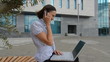laughing young businesswoman talking on phone