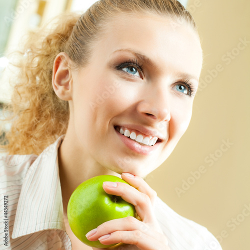 Photo: Happy smiling woman with apple Happy smiling woman with apple