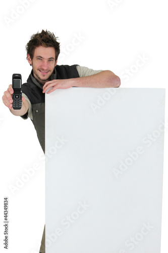 Photo: tiler showing phone tiler showing phone