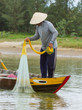 Photo: Fisherman is fishing with a large net in a river in Vietnam Fisherman is fishing with a large net in a river in Vietnam