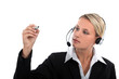 Call centre agent holding up a felt-tip marker