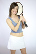 Happy female tennis player posing