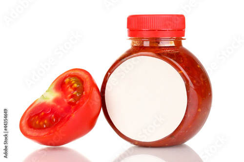 Photo: Tomato sauce in bottle isolated on white Tomato sauce in bottle isolated on white