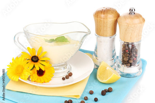 Photo: Mayonnaise in bowl on napkin isolated on white Mayonnaise in bowl on napkin isolated on white