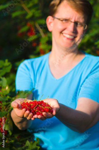 Photo: Redcurrant and woman Redcurrant and woman
