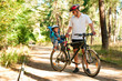 Father and little son on bike with child seat