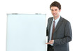 Photo: Happy businessman presenting something on flipchart stand Happy businessman presenting something on flipchart stand