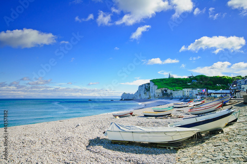 Photo: Etretat village, bay beach and boats. Normandy, France. Etretat village, bay beach and boats. Normandy, France.