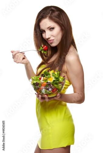 Photo: woman eating salad woman eating salad