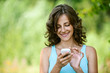 Photo: woman reads message to mobile phone woman reads message to mobile phone