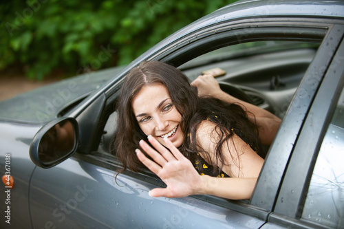 Photo: woman rides nice car woman rides nice car