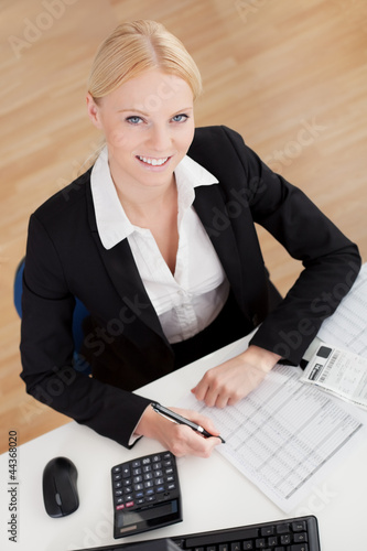 Photo: Cheerful accountant businesswoman Cheerful accountant businesswoman