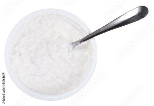 Photo: spoon in tub of cottage cheese spoon in tub of cottage cheese