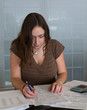 Foto: Young lady preparing USA tax form 1040 for 2012 Young lady preparing USA tax form 1040 for 2012