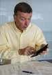 Senior man preparing USA tax form 1040 for 2012