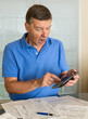 Senior man preparing USA tax form 1040 for 2012