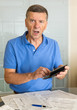 Senior man preparing USA tax form 1040 for 2012