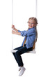Photo: Happy blonde girl sitting on swing Happy blonde girl sitting on swing