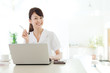Photo: Beautiful business woman using a laptop computer. Portrait of as Beautiful business woman using a laptop computer. Portrait of as
