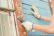 Young woman making cosmetic alterations of house