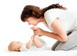 joyful mother playing with her baby infant