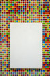 Photo: Blank paper board on colorful mosaic wall Blank paper board on colorful mosaic wall