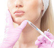 Portrait of a young woman laying on a botox injection procedure
