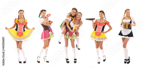 Photo: Six young women in Bavarian clothes holding fresh beer Six young women in Bavarian clothes holding fresh beer