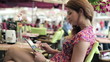 Happy young woman with tablet computer in cafe, steadicam shot