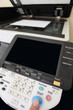 Finger pressing of keyboard buttons of the laser copier