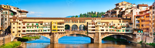Photo: Panoramic view of Ponte Vecchio at sunset in Florence, Italy Panoramic view of Ponte Vecchio at sunset in Florence, Italy
