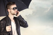 Photo: Man Holding Umbrella Man Holding Umbrella