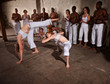 Photo: Capoeria Fighters Kicking and Dodging Capoeria Fighters Kicking and Dodging