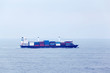 Large cargo ship floats in open ocean