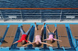 Photo: Top view of mother, son and little daughter lying at deck-chair Top view of mother, son and little daughter lying at deck-chair