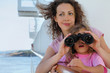 Photo: happy mother and daughter stand on ship board and surprised girl happy mother and daughter stand on ship board and surprised girl