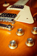knob control of electric guitar on floor