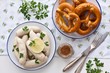 Munich white sausages with sweet mustard and pretzel