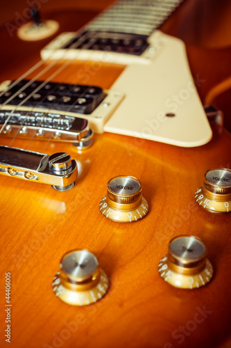 Photo: knob control of electric guitar on floor knob control of electric guitar on floor