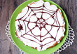 Date and chocolate cake with Halloween decoration - spider web